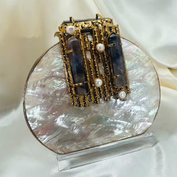 ASÓ ÉLAN ROUND LUXE CLUTH – MOTHER OF PERAL WITH AMYTHYST CRYSTAL & PEARL DETAIL